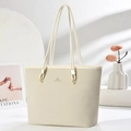 Detail of cream woven texture tote bag with golden metal hardware and long straps - Off-white