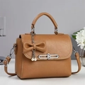 Brown lychee leather crossbody bag with pearl bow charm and vintage metal lock - Earthy Yellow