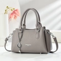Elegant grey lychee leather handbag with heart pendant and adjustable strap for women - Gray