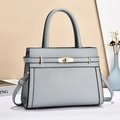 Elegant light blue lychee pattern leather handbag with gold twist lock and shoulder strap - Blue