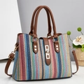 Colorful striped woven handbag with brown leather straps and golden hardware details - Blue