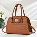 Elegant brown crocodile pattern handbag with leather bow and metallic silver buckle - Earthy Yellow