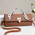 Brown textured leather handbag with polka dot silk scarf and gold lock detail - Khaki/Earth Yellow