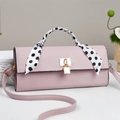 Pink leather handbag with a polka dot silk scarf handle and golden metal buckle clasp - Pink
