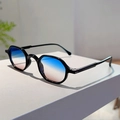 Detail of trendy black geometric sunglasses with blue to pink gradient lenses on stand - Black Frame Blue-White-Tea Gradient Lens