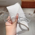 Transparent round frame anti-blue light glasses with gold metal accents and white case - Clear