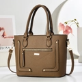 Detail of brown lychee grain leather handbag with gold hardware and fine stitching - Dark Khaki
