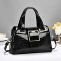 Elegant black crocodile embossed patent leather handbag with gold buckle and shoulder strap - Black
