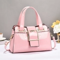 Pink crocodile-embossed patent leather handbag with gold metal buckle and top handle - Pink