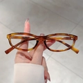 Fashionable oval sunglasses with amber tortoiseshell frames and clear lenses for women - Tortoise Frame Clear Lens