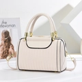 Off-white Boston handbag with vertical textures and gold chain strap in a soft setting - White