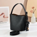 High-quality black litchi leather bucket bag with top handle and gold padlock charm - Black