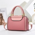 Pink pleated Boston bag in PU leather with dual top handles and gold-tone hardware - Pink