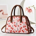 Sac fourre-tout rose avec imprimés cerises, anses en cuir marron et détails dorés - Rose