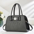 Dark grey pebble leather handbag with heart embossing and a stylish metal bow buckle - Gray