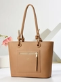 Chic tan pebble leather tote bag with gold hardware and stylish knotted handle detail - Apricot