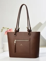 Brown lychee leather tote bag featuring a front zipper pocket with long tassels and gold logo - Coffee