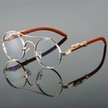 Occhiali da sole tondi retrò con montatura in oro, dettagli leopardo e aste in legno - Montatura Oro Lente Trasparente
