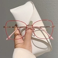 Detail of red thin metal frame glasses with rose gold temples and a white leather case - Red/Gold