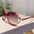Detailed side view of wine red sunglasses with elegant golden rose flower temple accents - Red Frame Gradient Grey
