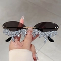 Detail of rimless oval sunglasses featuring deep brown lenses and luxury crystal trim - Gold Frame Grey Lens White Rhinestone