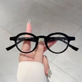 Occhiali retrò con montatura rotonda nera e lenti trasparenti anti luce blu per un look classico - Montatura Nero Lucido Lente Trasparente