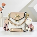Detail of crossbody bag with golden swan lock, crystal fringe, and plush monster charm - Khaki