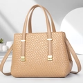 Detailed view of beige woven texture handbag with gold hardware and side pleat design - Khaki