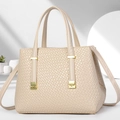 Detail of cream white handbag featuring dense woven texture and gold metal hardware - Light Khaki