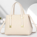 Detailed side view of cream-white crossbody bag with woven texture and gold buckle detail - Off White