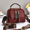 Elegant burgundy pebble leather handbag for women with stylish patterned wide shoulder strap - Wine Red