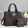 Three-piece dark brown woven tote bag set with golden metal logo in a minimalist setting - Coffee