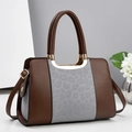 Fashionable leopard print tote bag with brown handles and gold-tone hardware accents - Gray