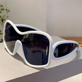 Detail of white wraparound Y2K sunglasses with oversized futuristic wave frame design - White Frame Gray Lens