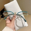 Close-up of cat-eye eyewear frames R5070 in dark green and gold with size details - Blue to Transparent Gold Frame