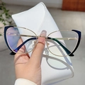 Detail of cat eye glasses in black and gold metal held with a white leather case - Black Gold Frame Transparent Lens
