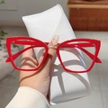 Eleganti occhiali rossi oversize cat-eye con finiture dorate e custodia in pelle - Montatura Rossa Lente Trasparente