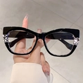 Classic black cat-eye glasses with geometric black and white patterned temple details - Black Frame Black White Striped Legs