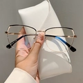 Polygonal cat-eye anti-blue light glasses in black and gold with white leather pouch - Black Gold Frame Transparent Lens