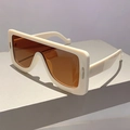 Close-up of white frame sunglasses with orange lenses and silver metal side accents - Rice White Frame / Tea Lens