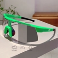 Detail showing photochromic cycling glasses lenses changing from clear to dark tint - Green Frame Photochromic