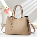Elegant apricot lychee texture tote bag with gold hardware and leaf pearl pendant - Khaki