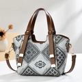 Chic geometric jacquard tote bag with brown leather handles and adjustable shoulder strap - Black
