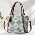 Elegant large tote bag with geometric print and silk scarf decor in a minimalist setup - Gray