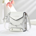 White faux crocodile skin crossbody bag with silver chain and rivet details - White