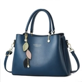Dark blue pebbled leather handbag with top handles and leaf charm accessory - Blue