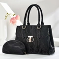 Detail of black textured tote bag set with golden hardware lock and pleated faux leather - Black