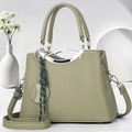 Elegante salbeigrüne Handtasche aus Leder mit Tragegriff und verstellbarem Schultergurt - Grün