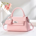 Pink lychee grain leather trapezoid handbag with silver turn-lock and mini charm - Pink