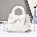 Elegant white crossbody bag with large bow detail and gold-tone round handle - White